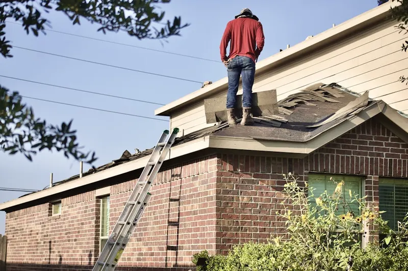 Professional roofer working on a residential roof in Seven Springs